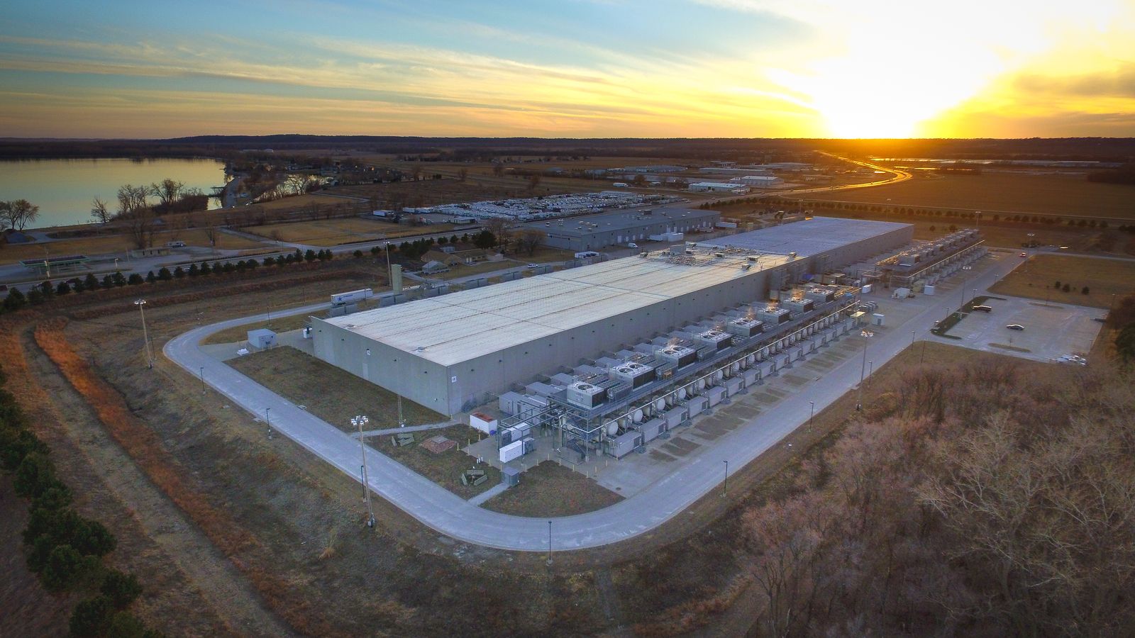 Aerial view of a hyperscale data centre campus at sunset